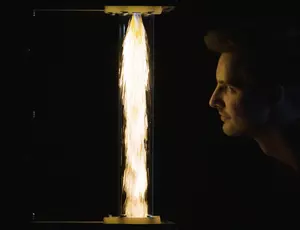 face looking at a flame